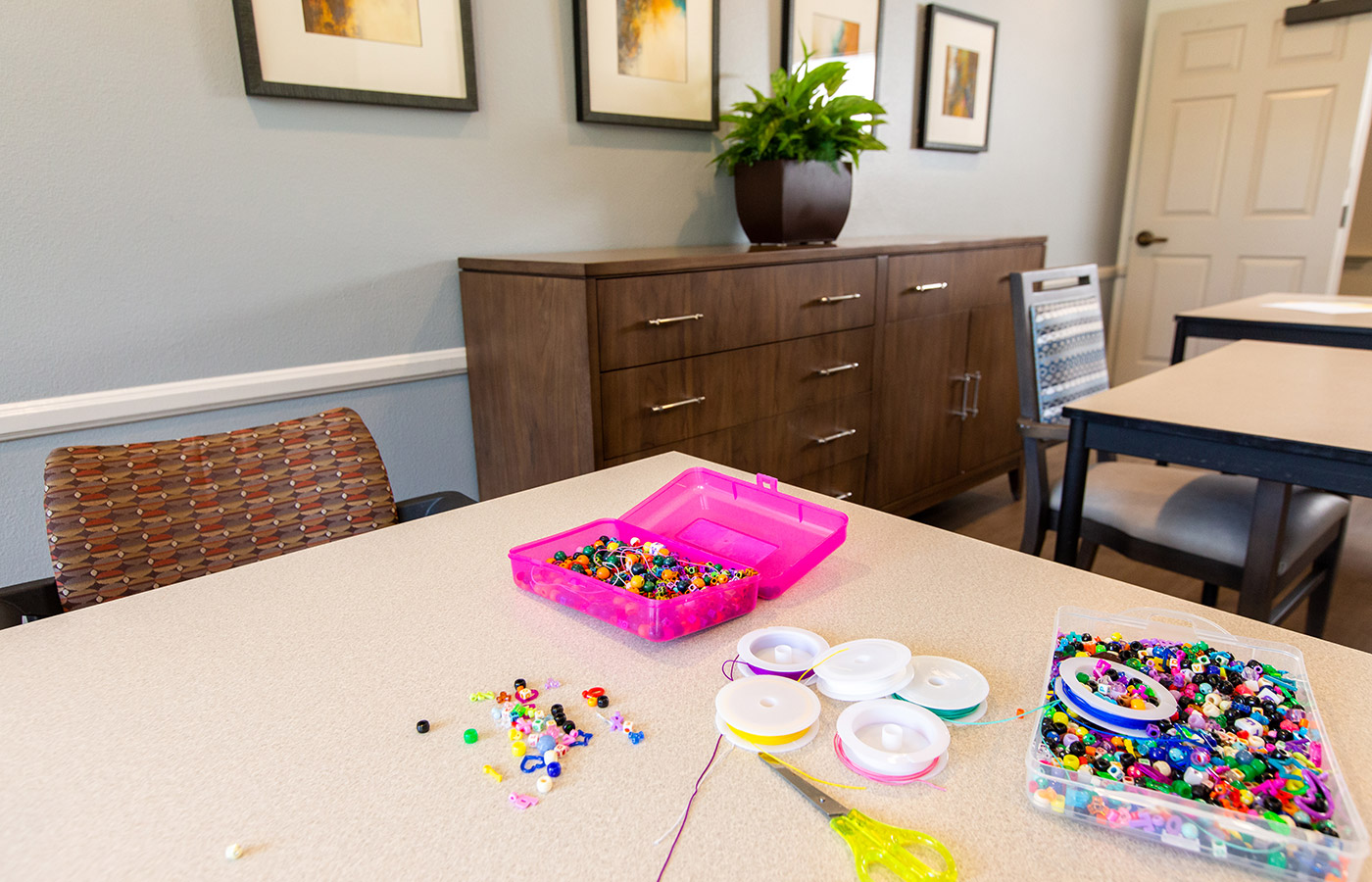 Beading materials are on a table at Whittier Place.