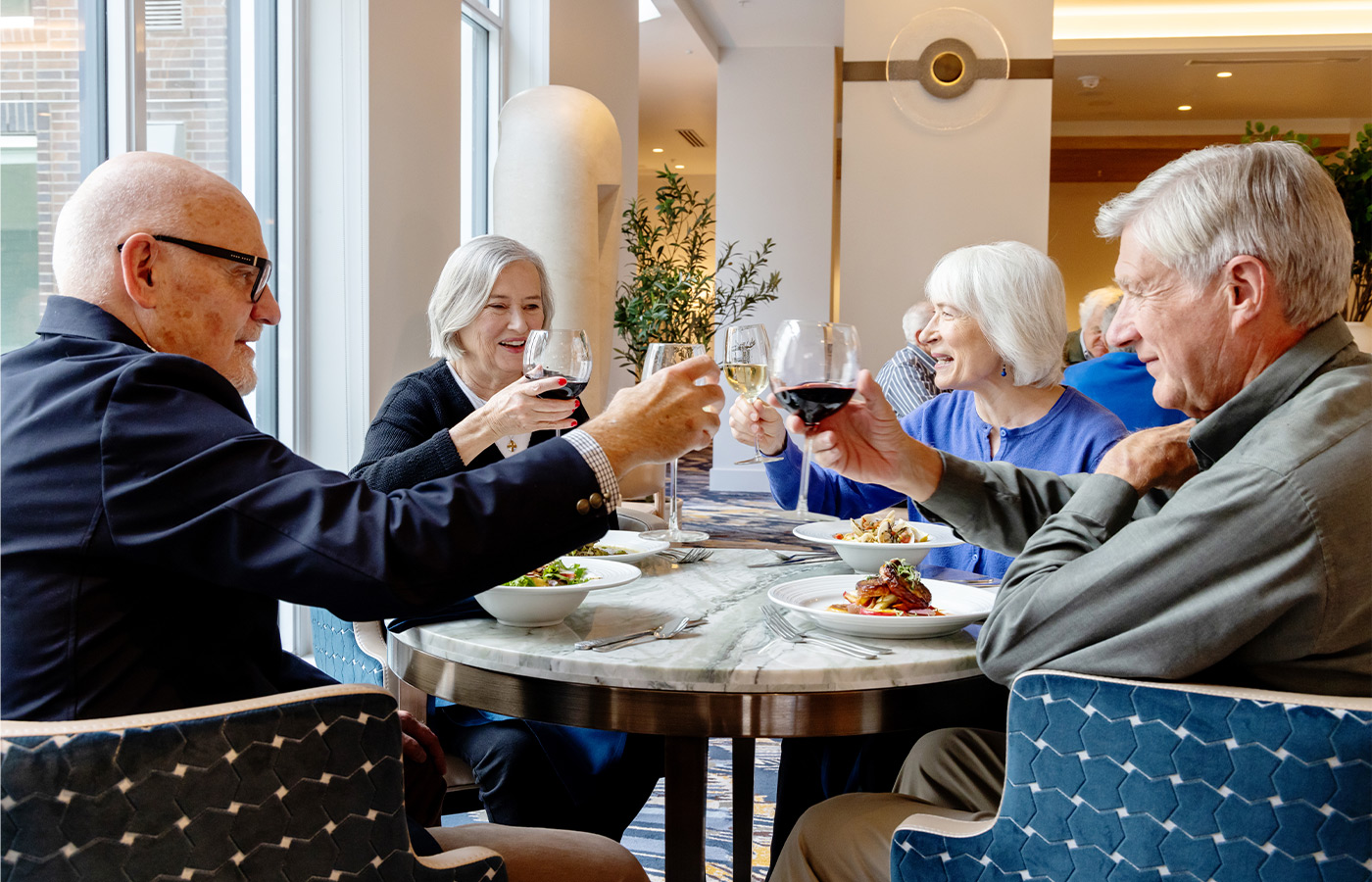 People toasting with wine.