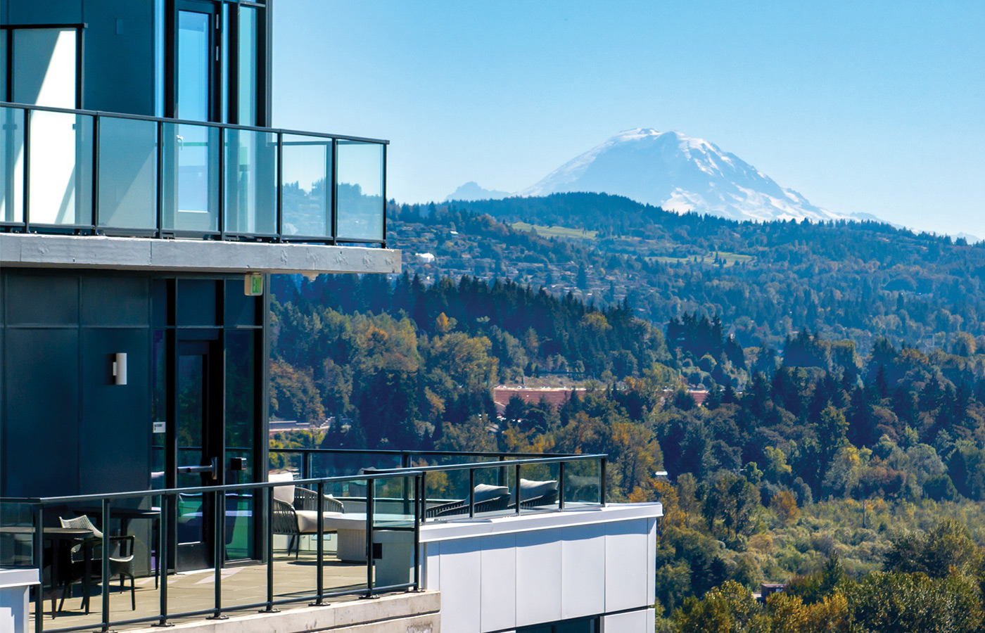 A balcony with mountains in the background.