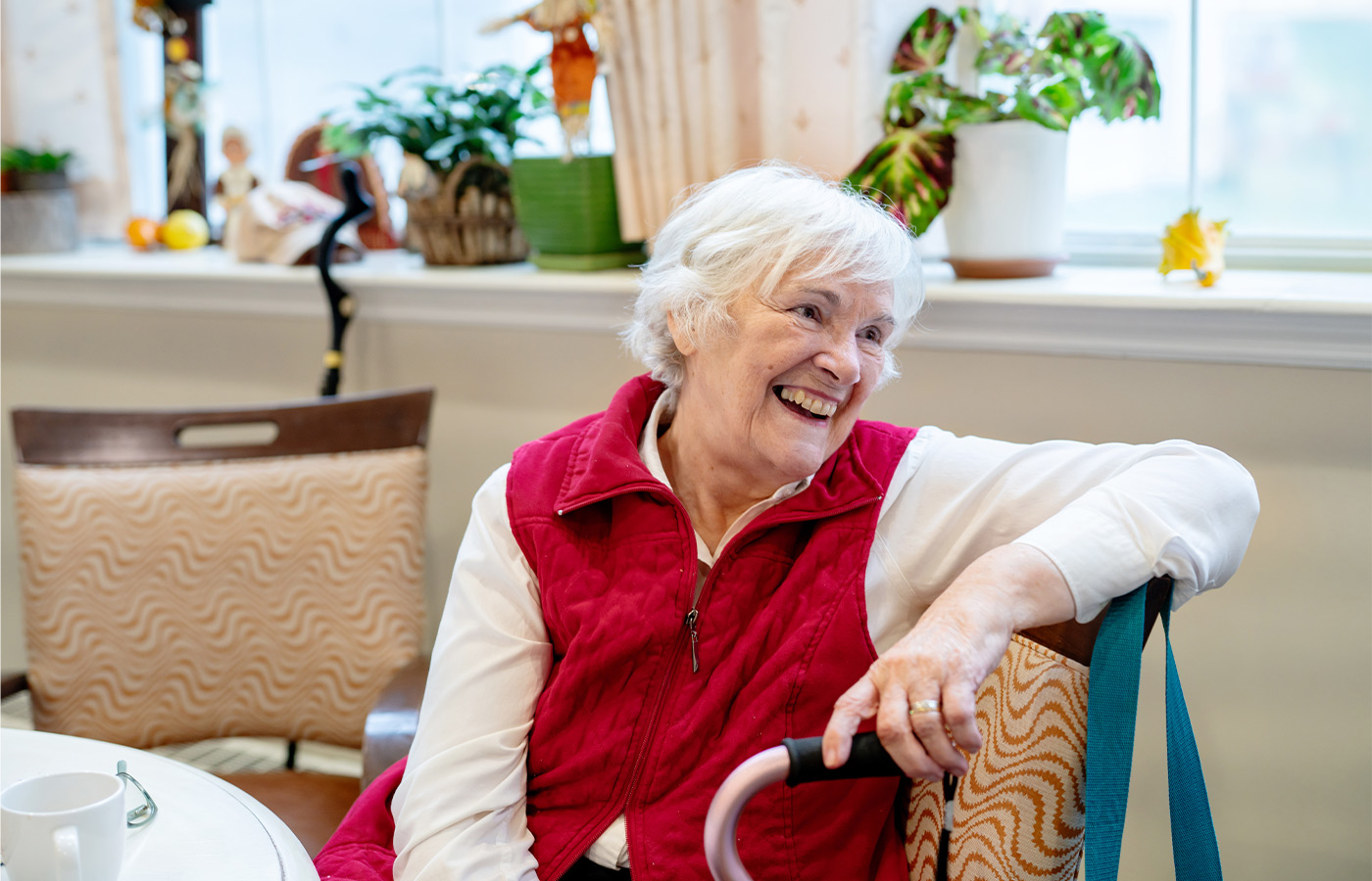 A person sitting and smiling.