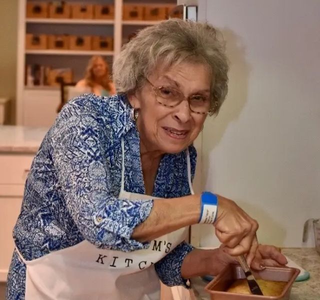 Resident mixing ingredients in bowl.