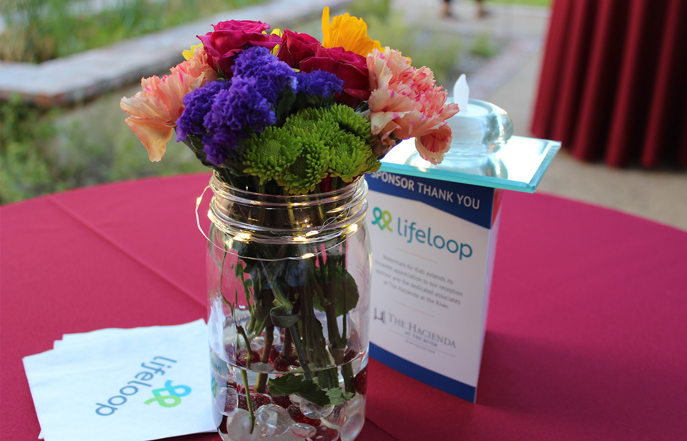 A table with a floral centerpiece.