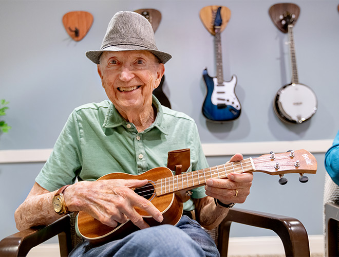 A person playing a guitar.