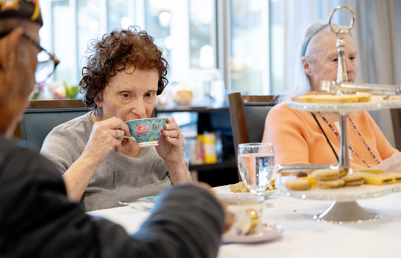 People at a table drinking tea.