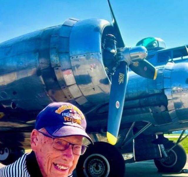 Resident in front of plane