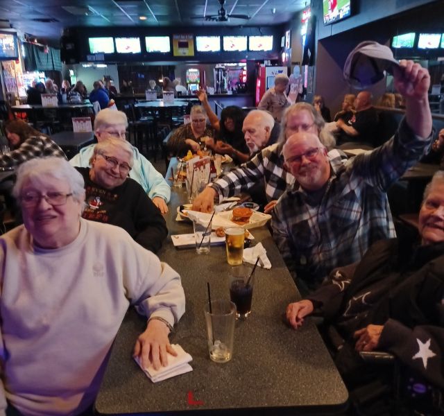 Table at a restaurant with happy customers.