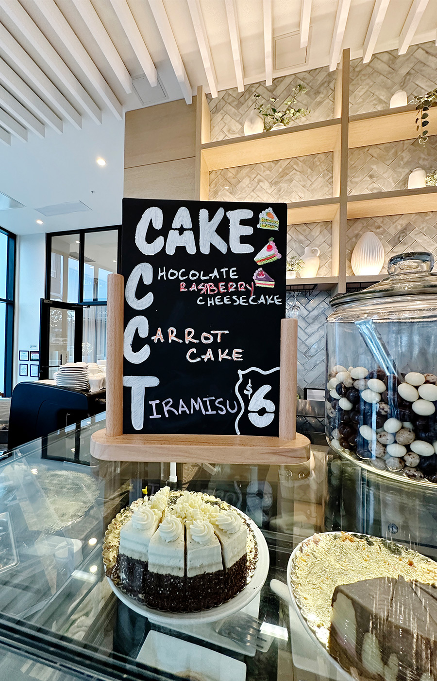 A display case with a chalkboard sign on top.