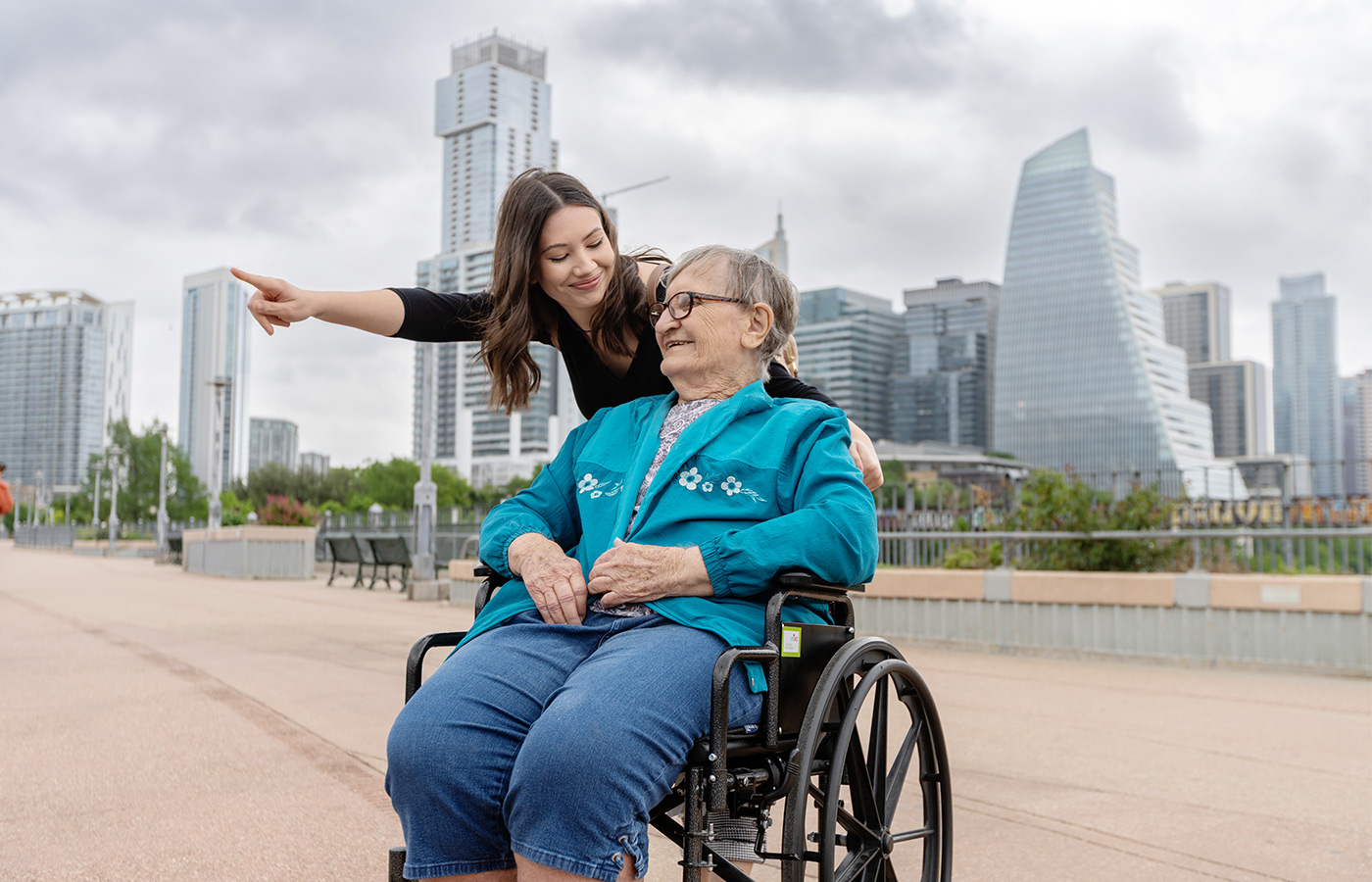 two people site seeing in front of a cityscape