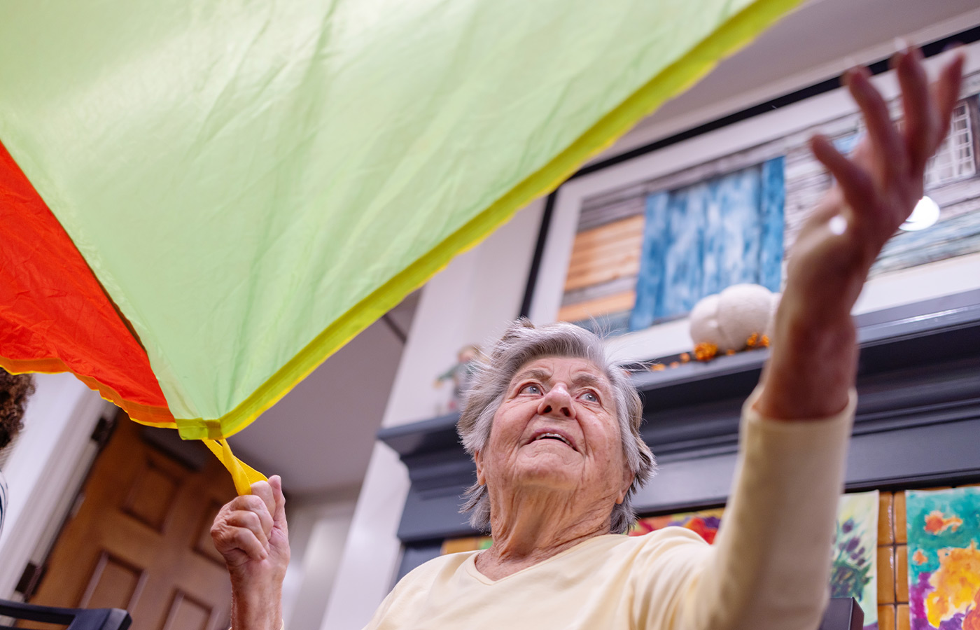 A person playing with a parachute.