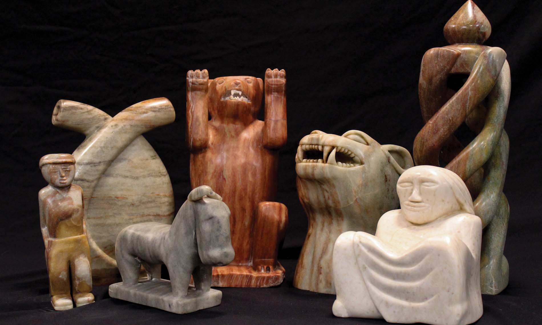 Multiple pieces of neutral toned sculptures.