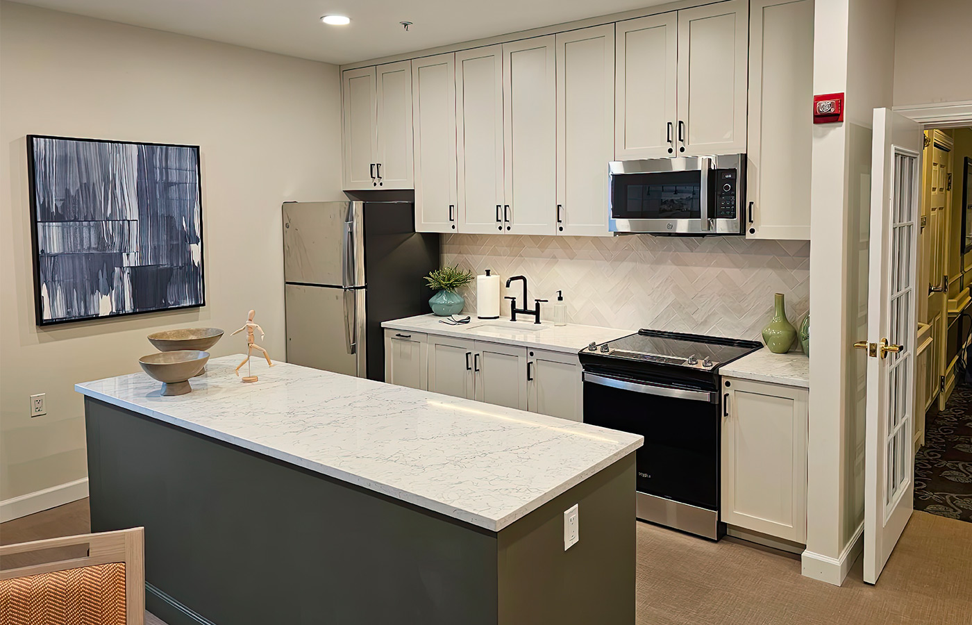 A kitchen with cabinets and a counter.