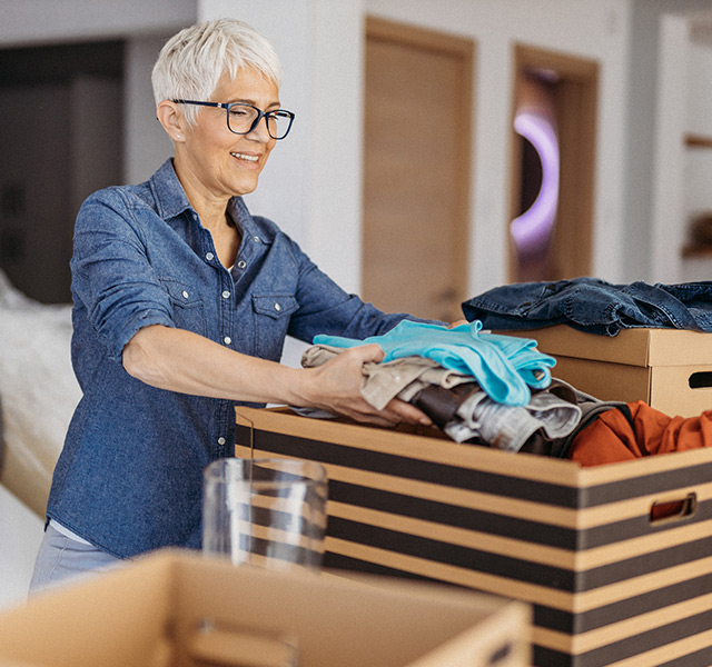 A person packing boxes.