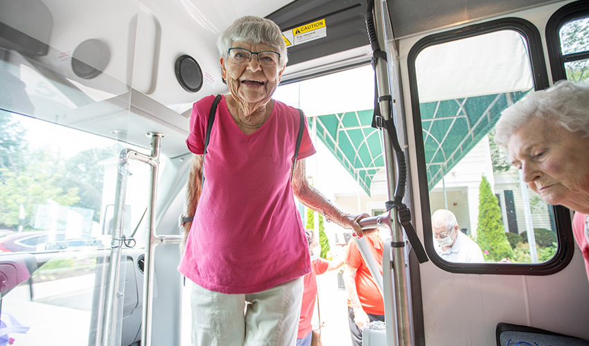 A person getting on a bus.