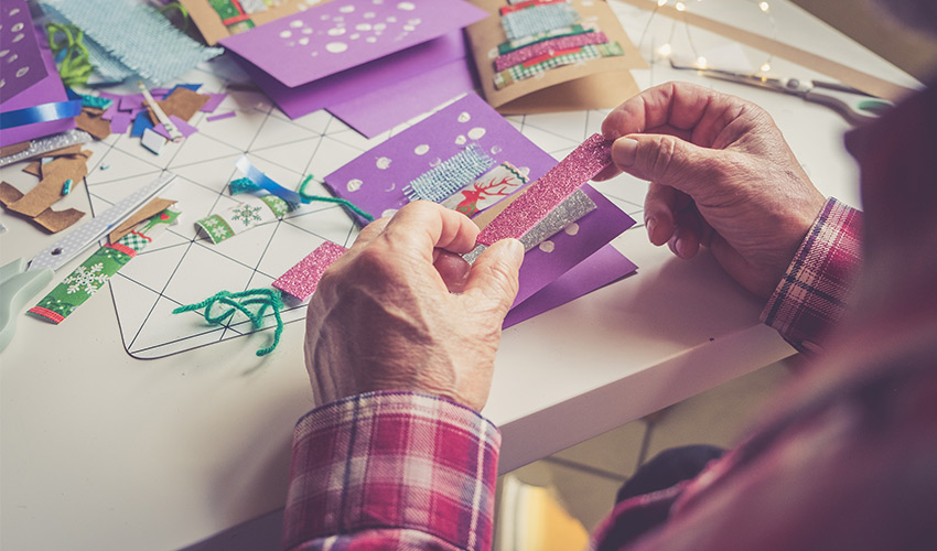 A person making a card.