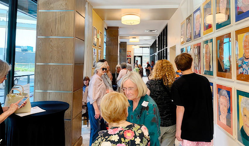 A group of people at an art exhibit. 