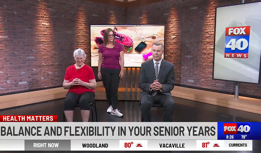 Two people on the news with a personal trainer.