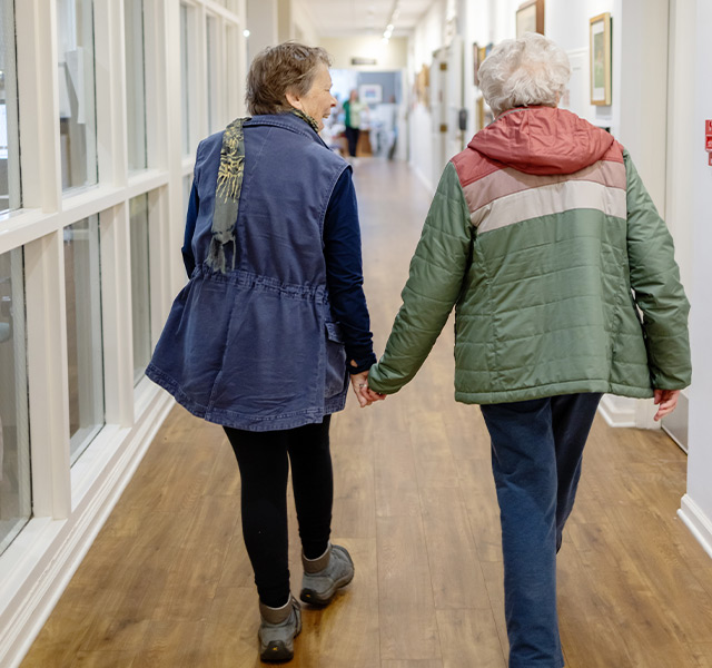 Two people walking.