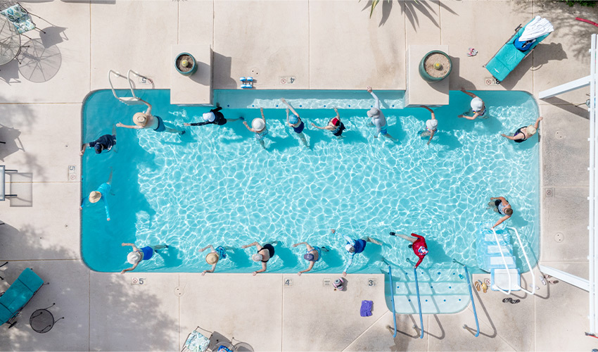 People doing water aerobics in a pool.